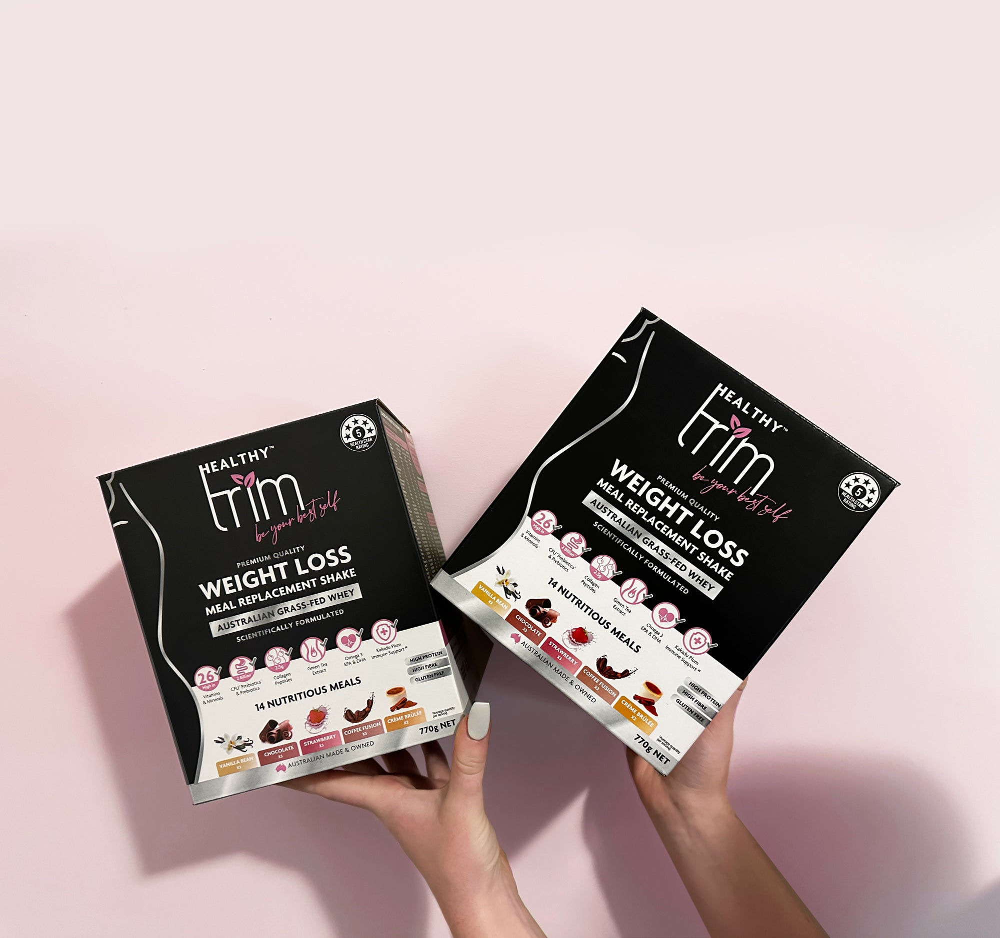 Lady holding up Healthy Trim's 2 variety boxes.